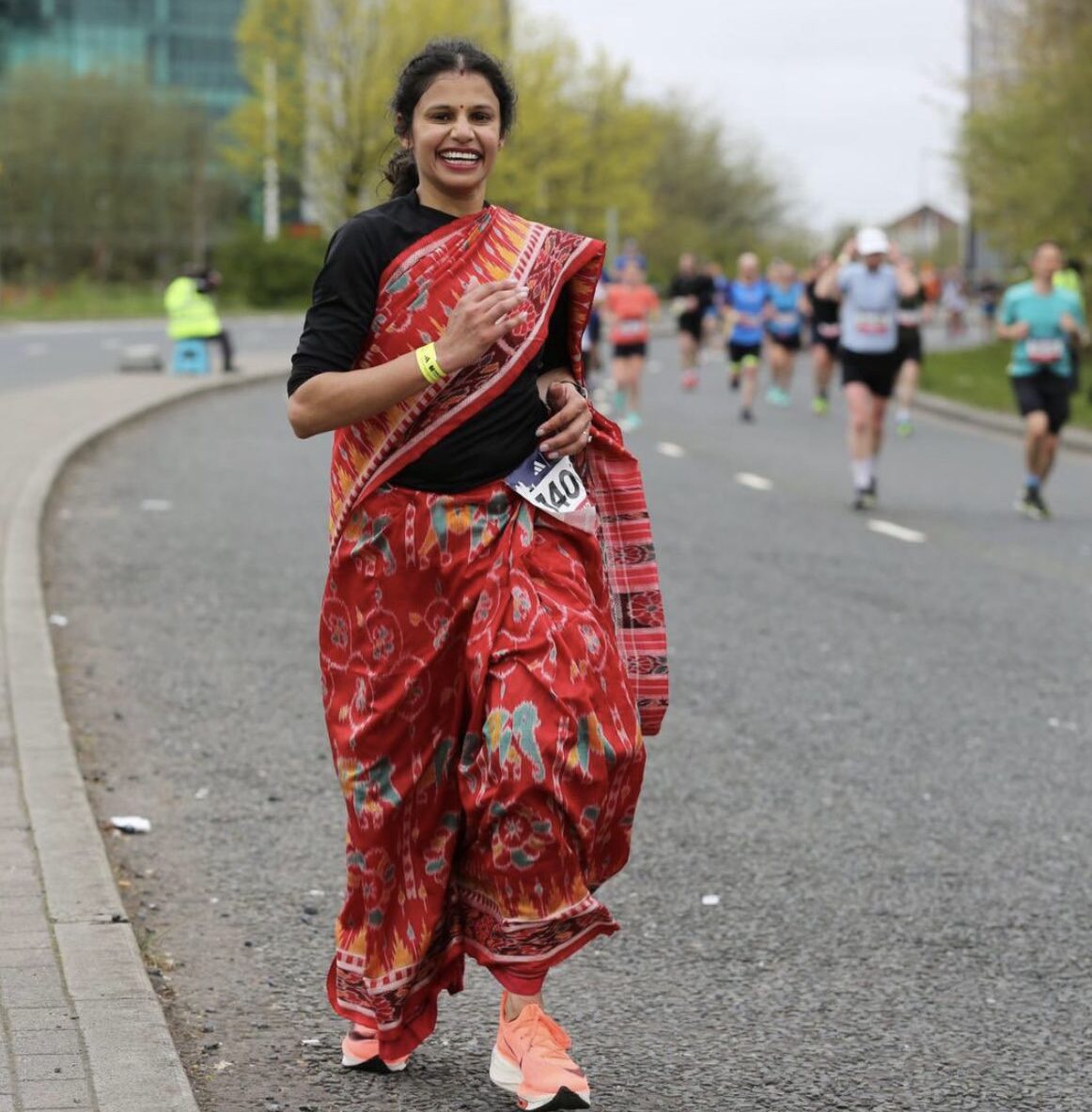 Woman sets new record by running marathon wearing Sambalpuri saree