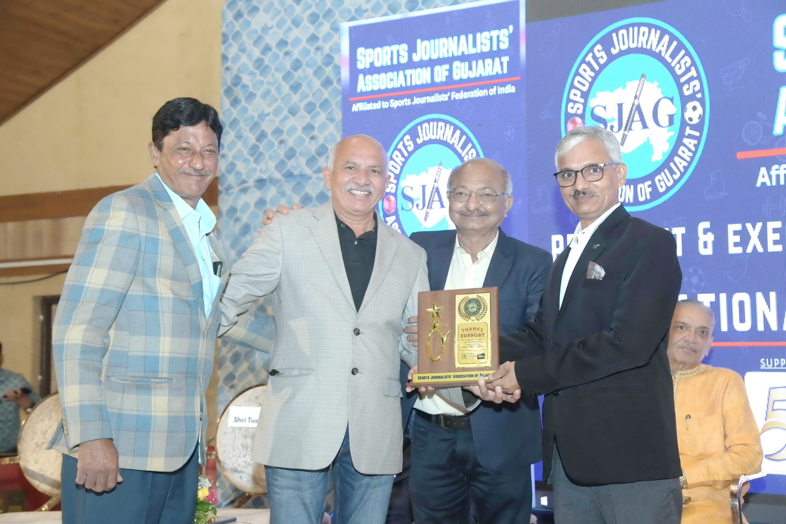 A program honoring famous athletes and coaches was held at the Rajpath Club in Ahmedabad