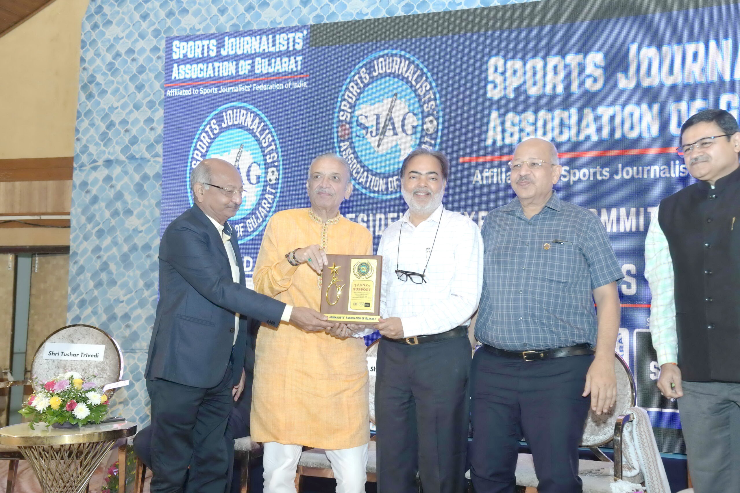 A program honoring famous athletes and coaches was held at the Rajpath Club in Ahmedabad