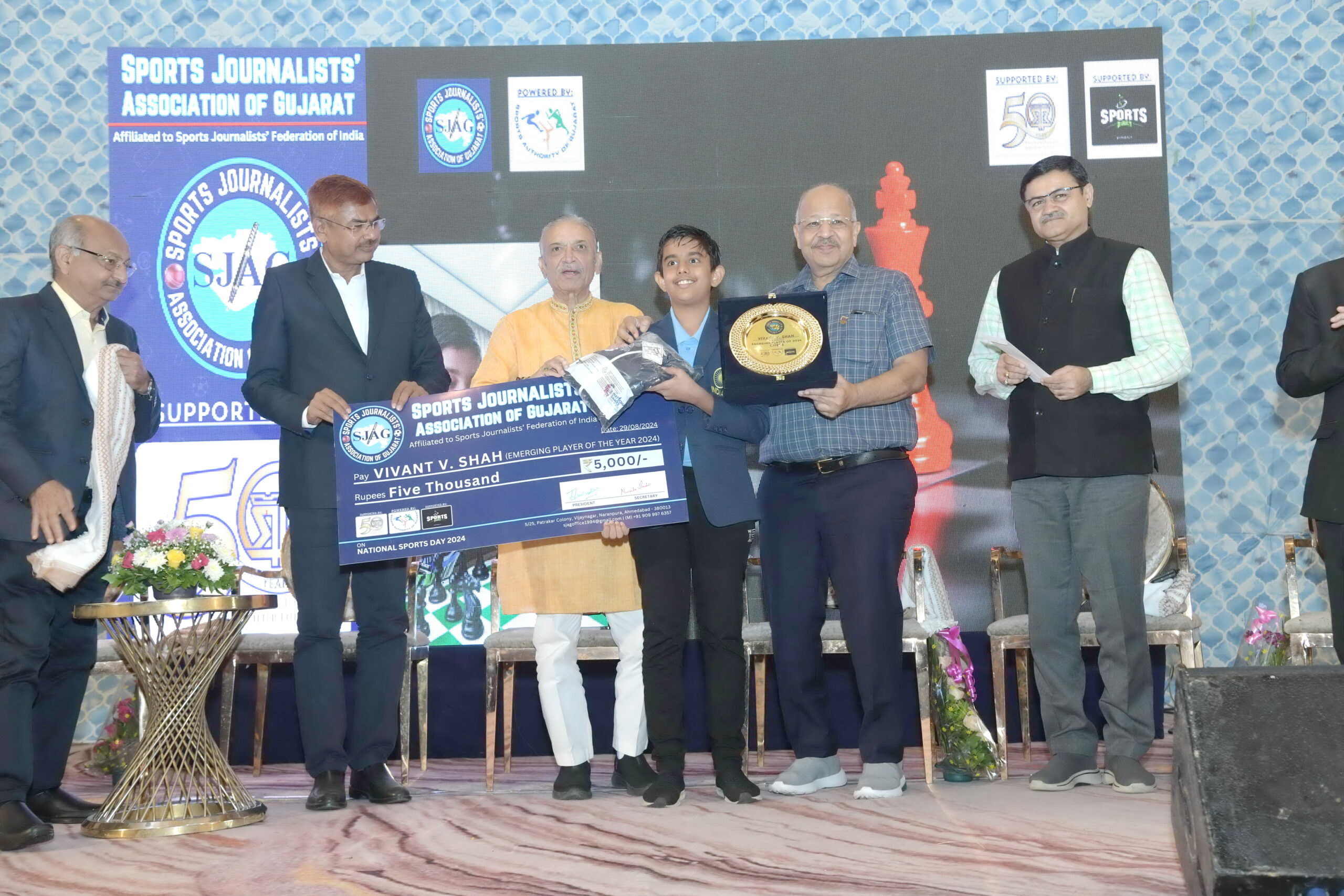 A program honoring famous athletes and coaches was held at the Rajpath Club in Ahmedabad