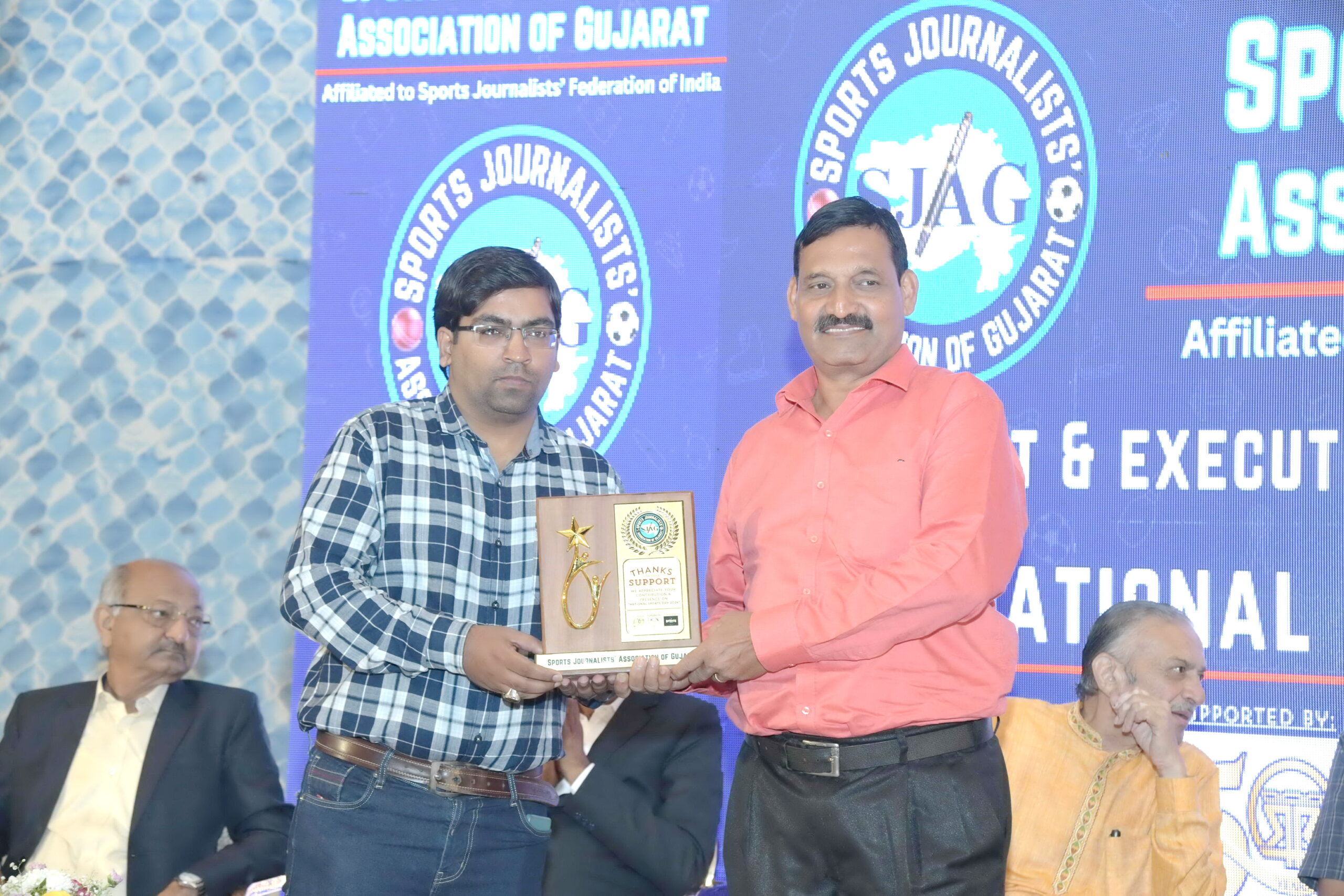 A program honoring famous athletes and coaches was held at the Rajpath Club in Ahmedabad